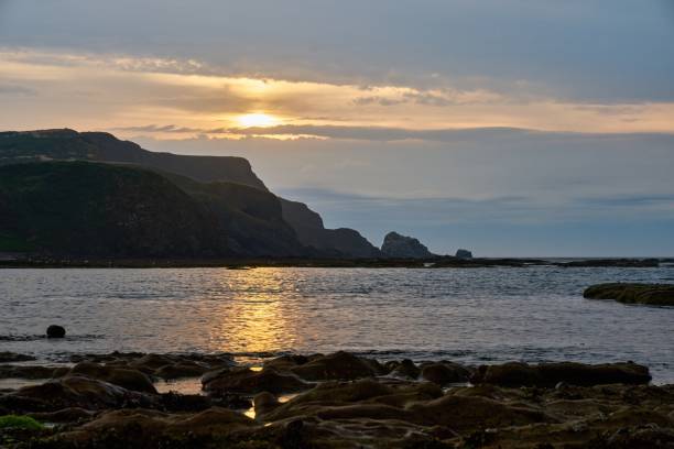 istock sunset over the bay of Aberdour bay and its cliffs 1446472065