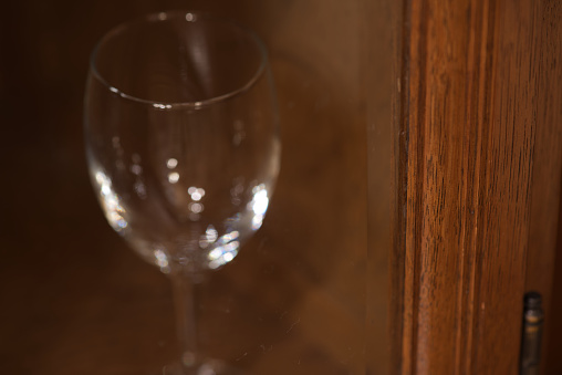 Wine glass in cupboard.
