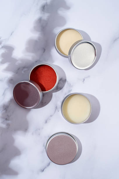 istock colorful lip balms in round tin cases with shadow overlay, mockup design 1446476093