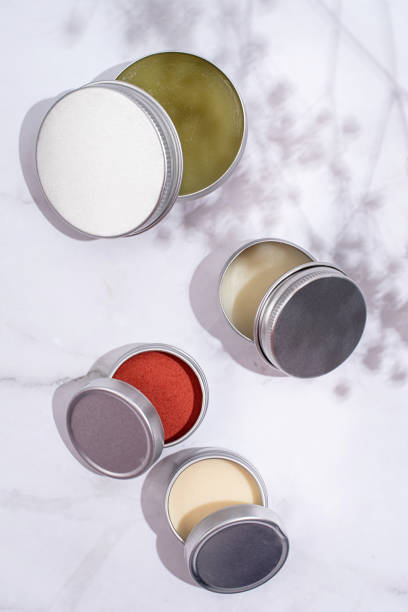 istock colorful lip balms in round tin cases with shadow overlay, mockup design 1446477853