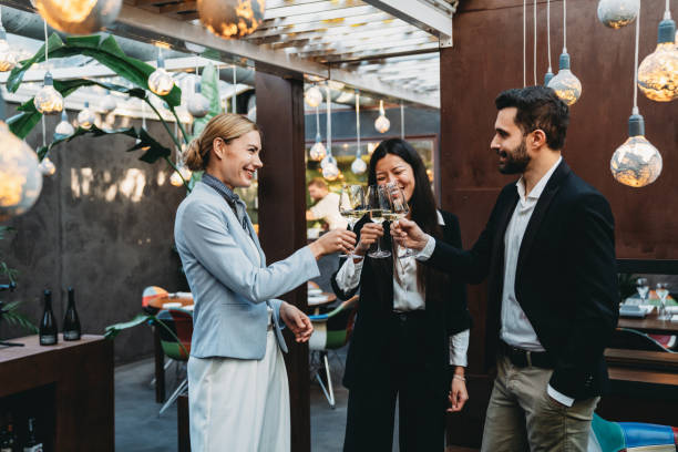 istock Business people are talking together at the restaurant while drinking wine for the aperitif 1446478782