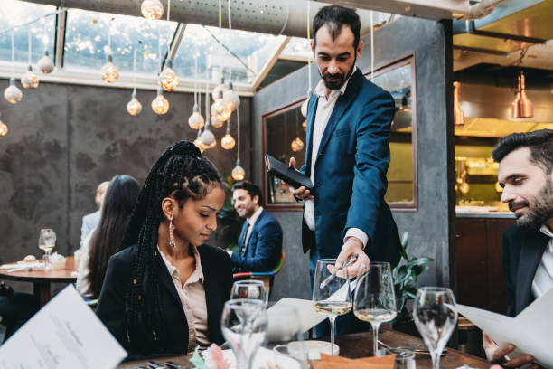 istock A waiter is taking orders in an high-end luxury restaurant 1446478872