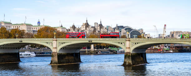 istock Iconic red double-decker buses crossing Westminster Bridge 1446479346