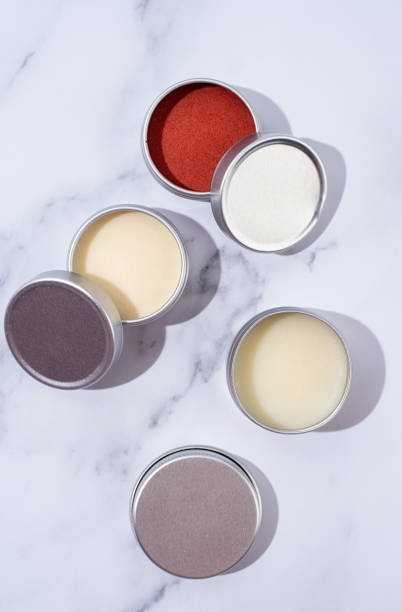 istock colorful lip balms in round tin cases with shadow overlay, mockup design 1446480910