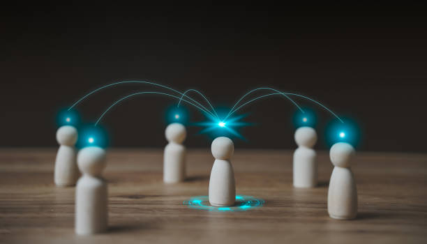 istock Business and communication technology concept. Chain of people figurines connected. Cooperation and interaction between people and employees. Dissemination of information in HR & society. 1446481232