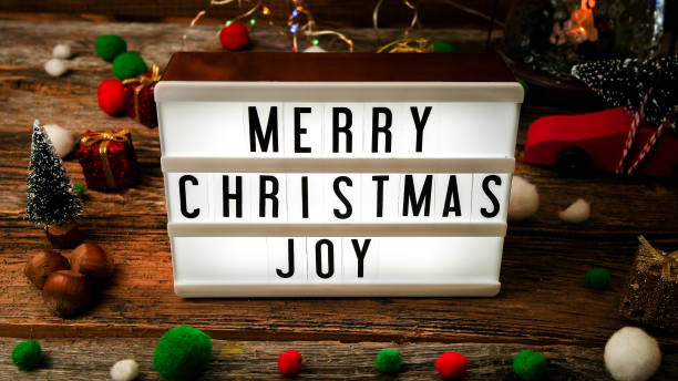 istock Light box with Christmas wish on rustic wooden table 1446487700