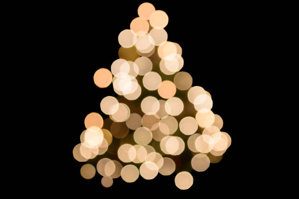 Abstract Christmas Background - Defocused bokeh lights on a Christmas tree with a black background