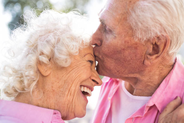 istock old modern couple dressing fashionable colored clothes 1446489900