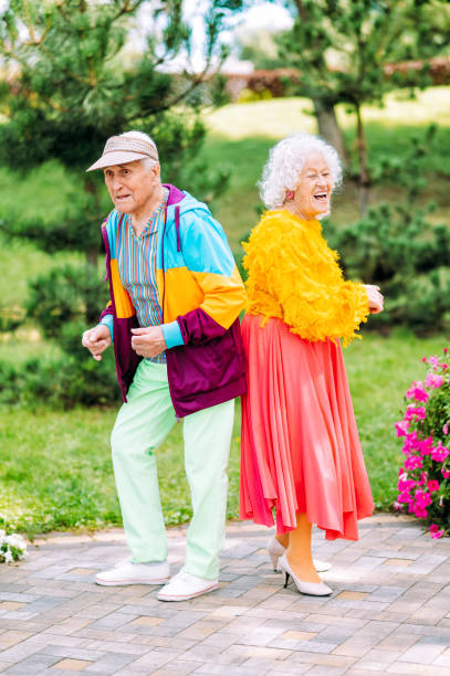 istock old modern couple dressing fashionable colored clothes 1446490124