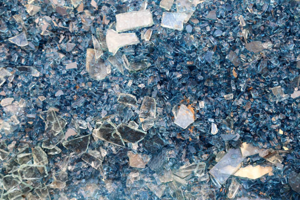 istock Broken windows, a lot of broken windows at the construction site or building. Shards of laminated blue glass 1446490474