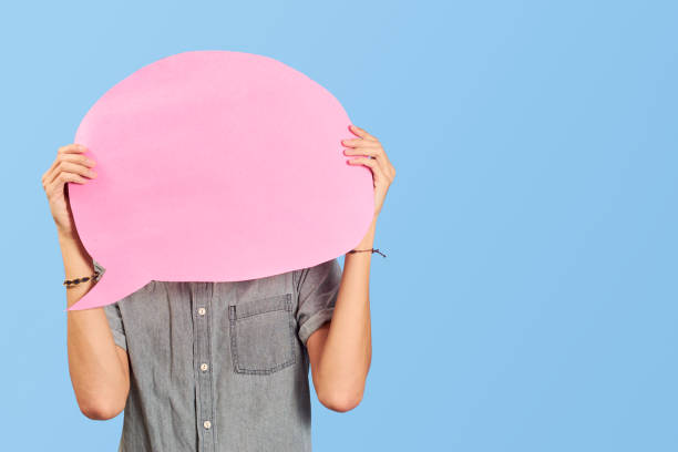 istock Young man with blank dialogue bubble on blue flat lay. 1446494808