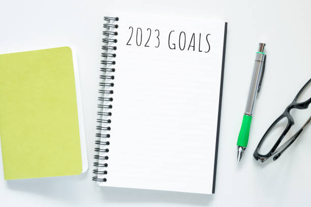 istock Notebook with 2023 goals text on it to apply new year resolutions and plan. 1446495654