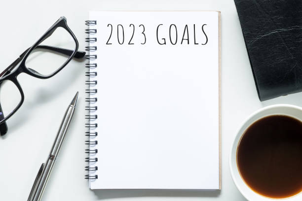 istock Notebook with 2023 goals text on it to apply new year resolutions and plan. 1446495655