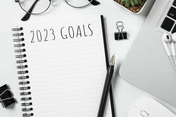 istock Notebook with 2023 goals text on it to apply new year resolutions and plan. 1446495768