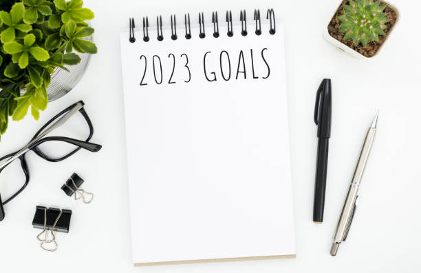 istock Notebook with 2023 goals text on it to apply new year resolutions and plan. 1446495782