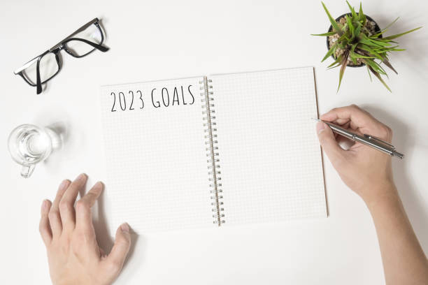 istock Notebook with 2023 goals text on it to apply new year resolutions and plan. 1446495813