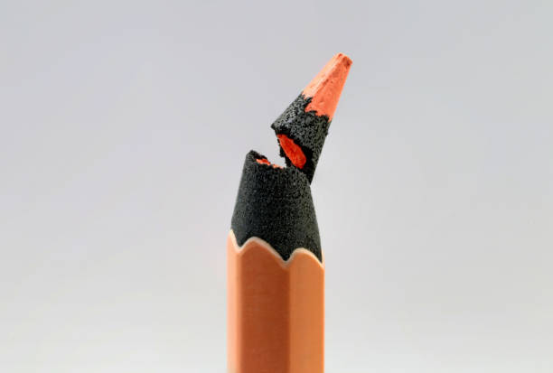 istock The broken tip of a pastel orange paint or pencil 1446499253