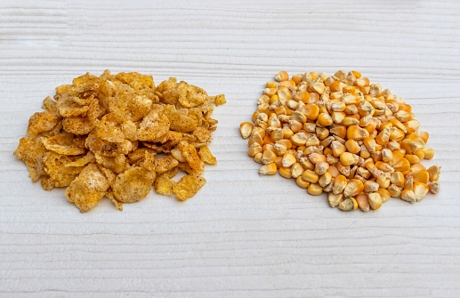 Corn Flakes and Maize Seeds Isolated on White Background.