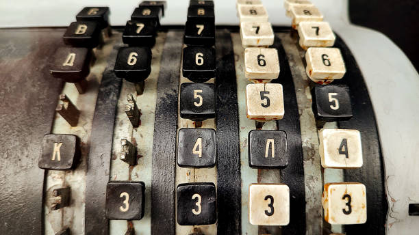 istock old soviet typewriter with black and white dirty keys with cyrillic numbers and letters - closeup of a retro, outdated and broken apparatus for writing and accounting with vintage appearance 1446501998