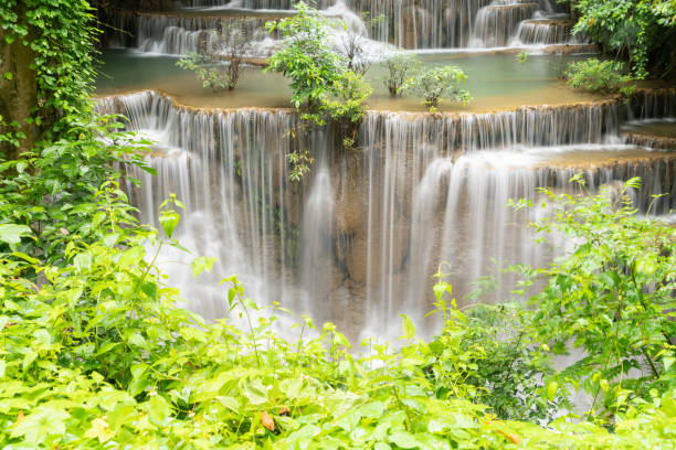 Erawan Waterfall. Nature landscape of Kanchanaburi district in natural area. it is located in Thailand for travel trip on holiday and vacation background, tourist attraction. Erawan Waterfall. Nature landscape of Kanchanaburi district in natural area. it is located in Thailand for travel trip on holiday and vacation background, tourist attraction. kanchanaburi province stock pictures, royalty-free photos & images