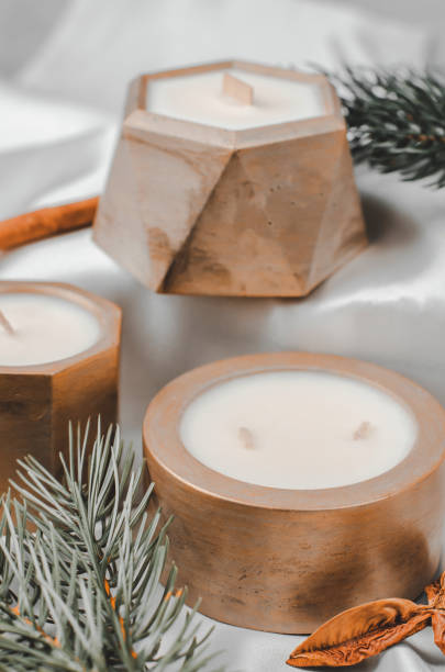 istock Decorative candles in a pot and fir branches, festive composition, selective focus 1446507172