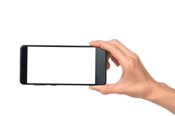 istock Black smartphone in a female hand on a white background, isolate. Smartphone with blank white display for advertising. 1446507179