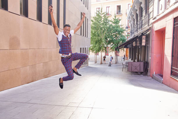 istock African-American man jumping for joy 1446508026