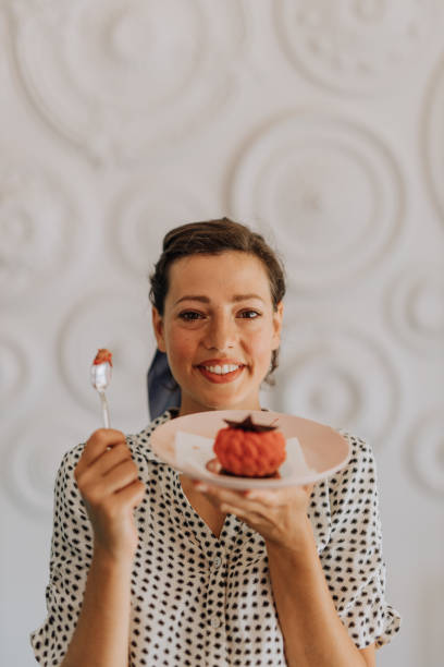 dulces encantadores - women spoon tasting elegance fotografías e imágenes de stock