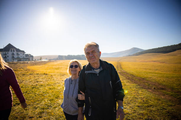 istock Caucasian senior married couple, holding hands, while enjoying autumn hike 1446514493