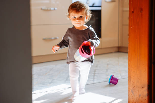 istock First steps of little girl at home interior 1446518453