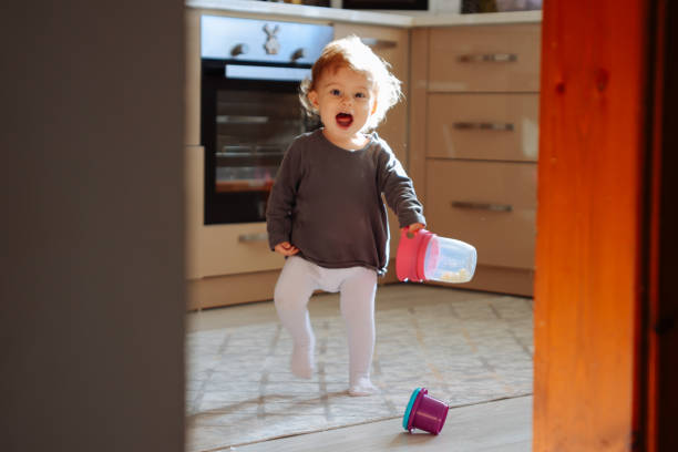 istock First steps of little girl at home interior 1446518562