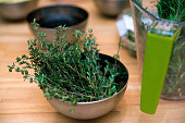 Fresh thyme many sprigs in a bowl. Fresh seasoning before cooking.