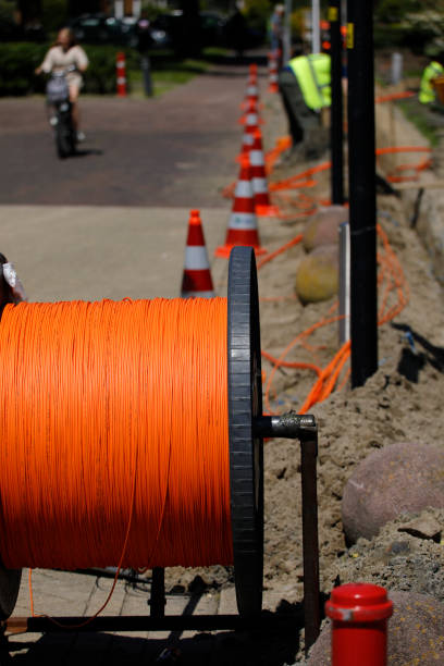 Installation and connecting fibre optic cables to neighbouring houses