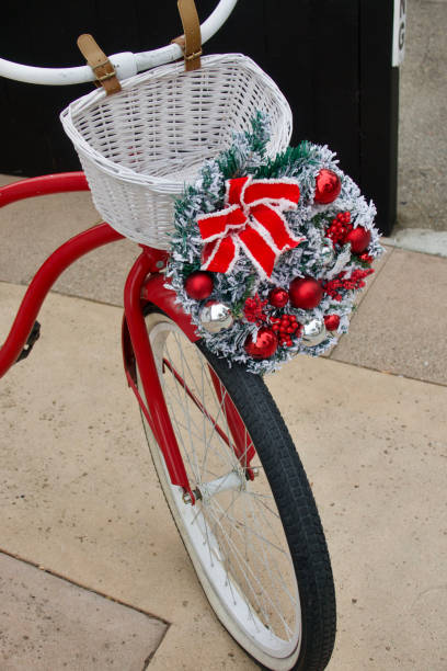 istock Classic red beach cruiser bicycle with holiday wreath and white basket 1446522812