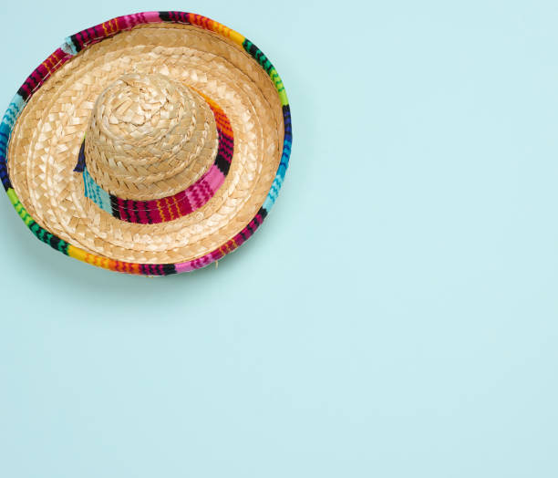 istock Straw mexican hat on blue background, top view 1446523647