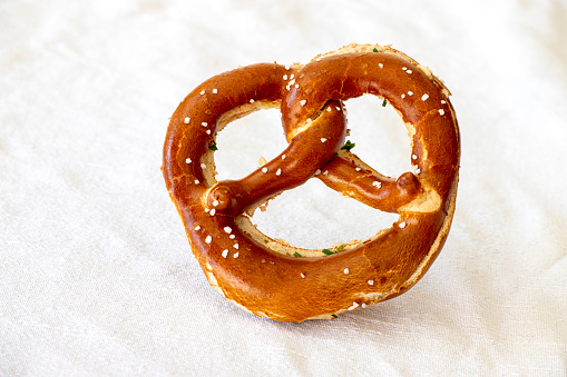 bavarian pretzel with butter on white