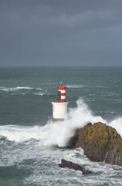 istock Rough sea and waves over the lighthouse of Pasaia, Euskadi 1446524967