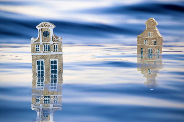 Graphic image of partly submerged houses whose structure resembles the historic Dutch - styled architecture