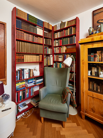 Library, armchair edge with lamp