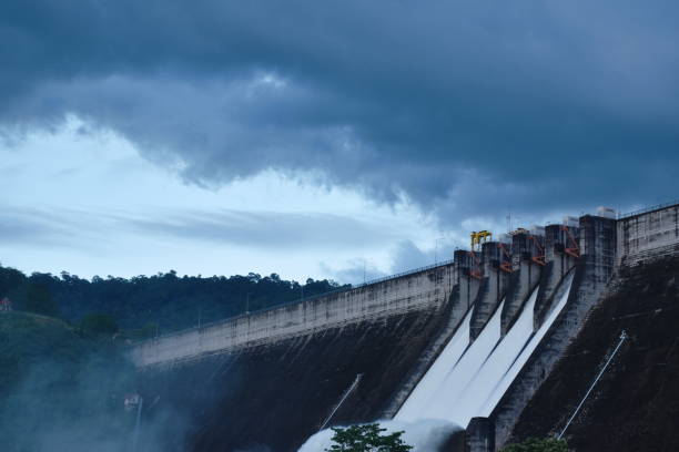 istock water splashing from floodgate Khun Dan Prakarn Chon huge concrete dam on night i 1446529490