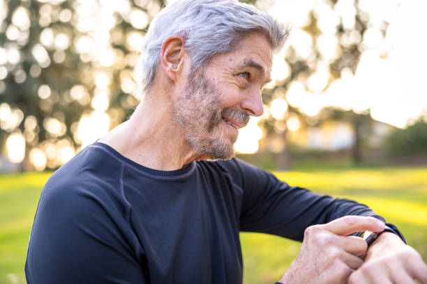 istock Senior man using smart watch for fitness during exercise 1446537520