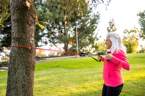 istock Senior woman strength training with resistance bands 1446538717