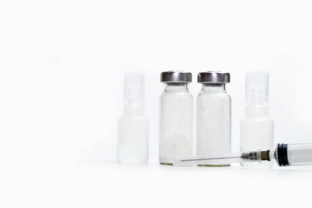 istock Vaccine bottles and syringes isolated on white background with space for text. Vaccination concept. 1446542469