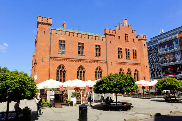 Kolobrzeg, Poland - June 23, 2016: Side view of the neo-Gothic building of Town Hall that was built from 1829 to 1832 and rebuilt in 1913