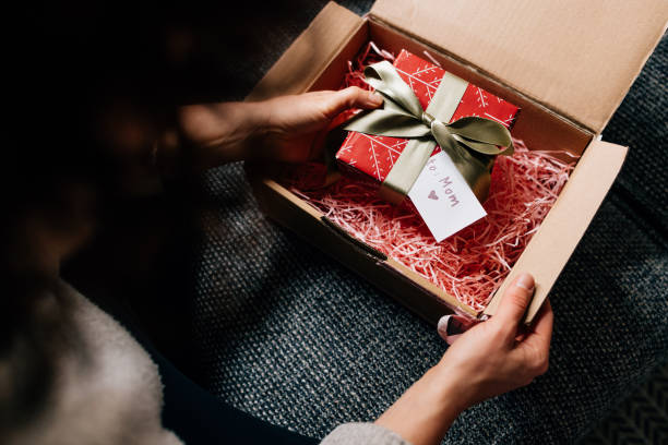 istock Mother's Day: Hands of a Woman Receiving a Present 1446544128