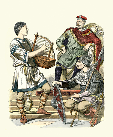 Vintage illustration Medieval fashion of Carolingian era, 700 to 800 AD, King or nobleman, Warrior and Harpist, History of Fashion