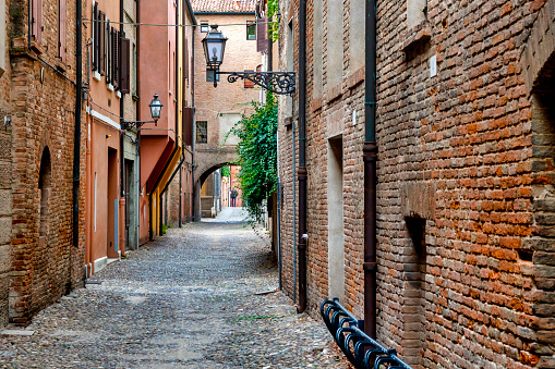 Cobblestones street in the historical centre of Ferrara, Italy