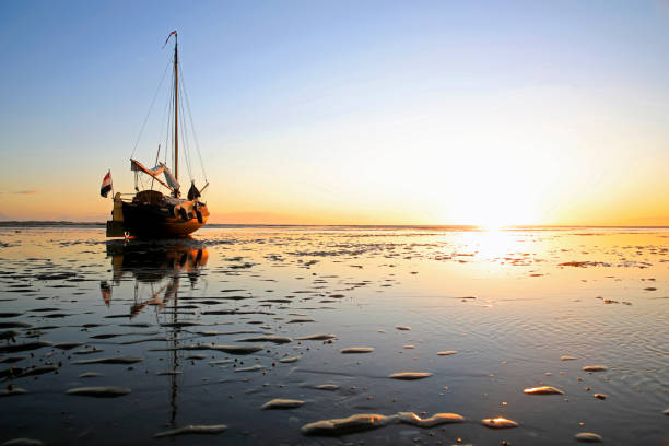 istock A sailboat lying on a sandbank during low tide 1446551605