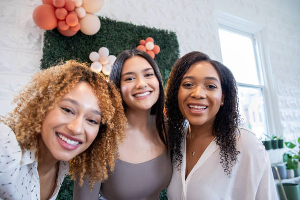 istock Diverse group of friends smile for selfie while attending party 1446555738