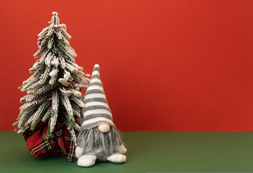 christmas tree and gnome gonk with copy space background. High quality photo